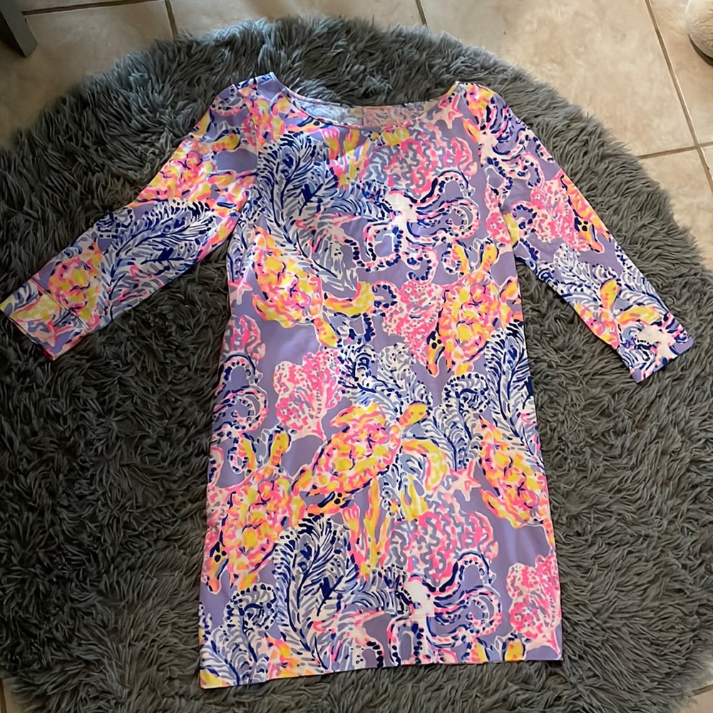 the is one dress is color light purple wit some pink and yellow